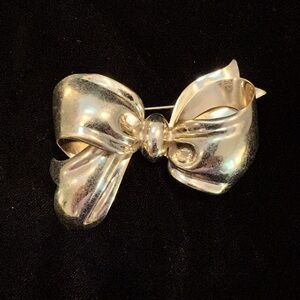 Monet gold plated bow brooch